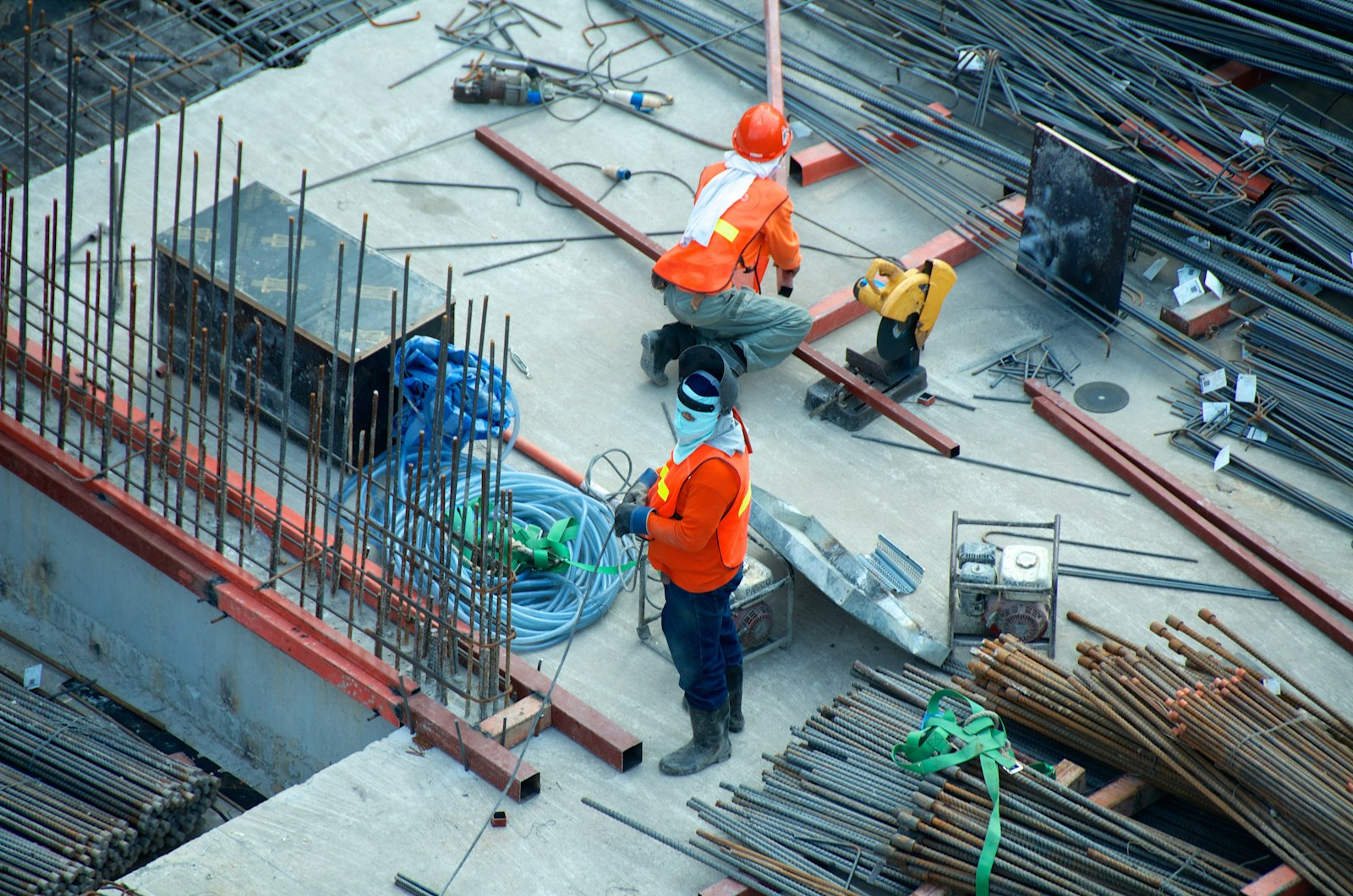 Crew placing rebar on a slab in morning light