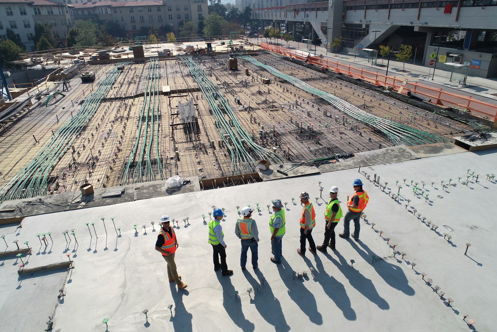 Crew laid out across a slab pour on a wide site