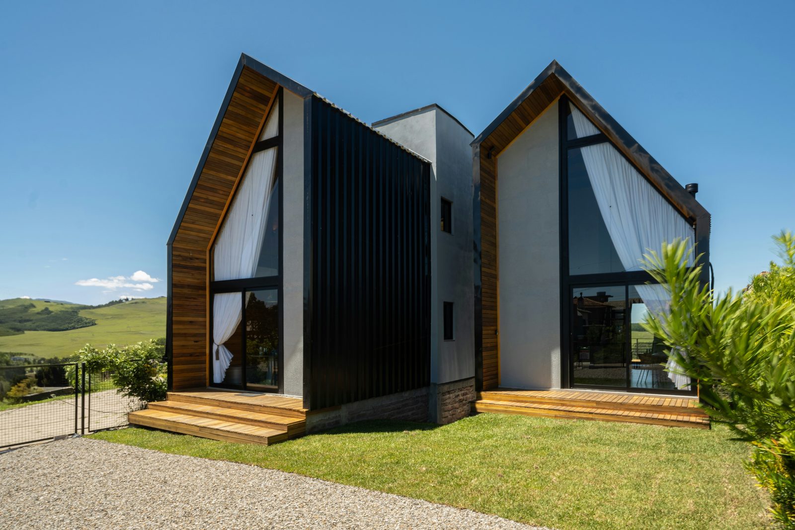 Finished dark-clad custom home at dusk